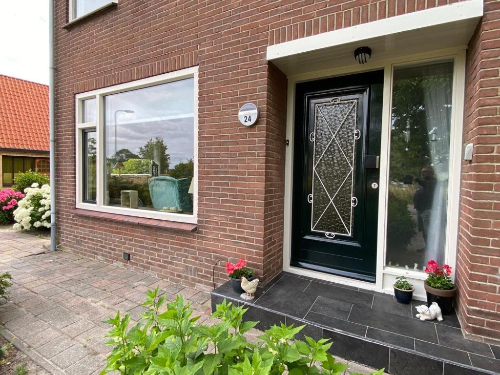 Huis Bij Het Water Met Sloepje Jutrijp Bagian luar foto